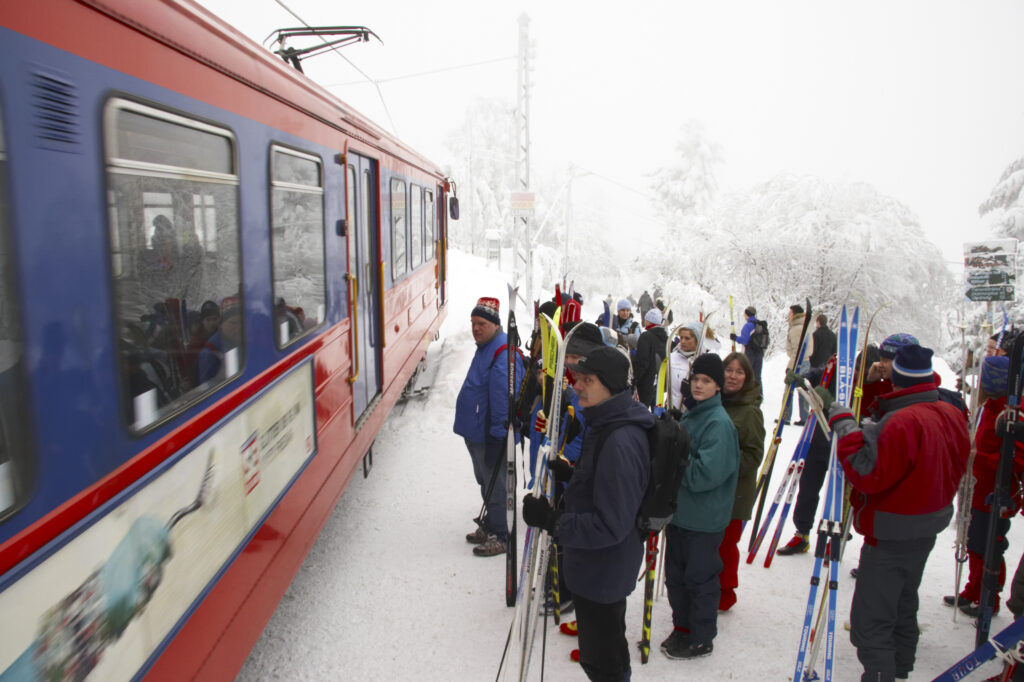 Norway, Oslo, Frognerseteren Skiers and snow boarders wait to board a metro at the Frognerseteren station near Tryvann Skifield