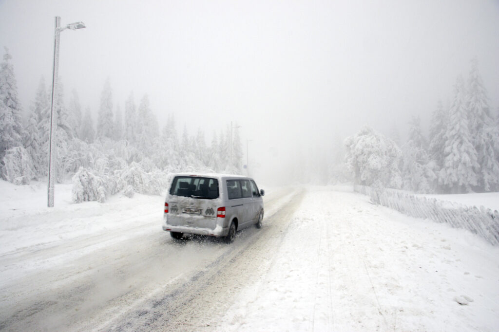 Norway, Oslo, Holmenkollen. A car using a quiet road up to the upper slopes of the Tryvann Skifield in the Holmenkollen area