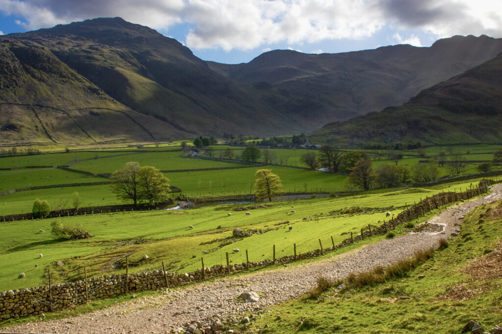 England, Cumbria, Lake District National Park. Storm clouds clear above the glaciated valley of Great Langdale at the point where the valley divides at Stool End to form the Mickleden and Oxendale.