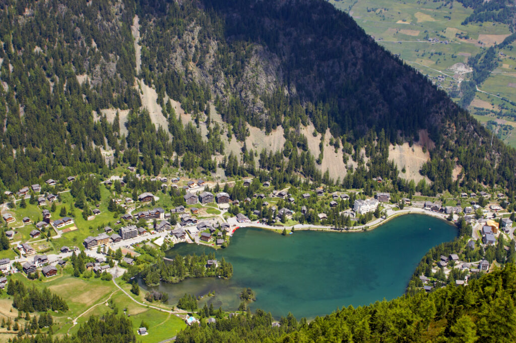 Switzerland Valais Val d Arpette A view looking above Champex towards the artificial Lac de Champex and surrounding forest.