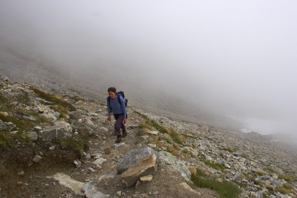 Switzerland Valais Val d Arpette A female hiker heading along the route from La Breya towards Orny near the popular Champex town