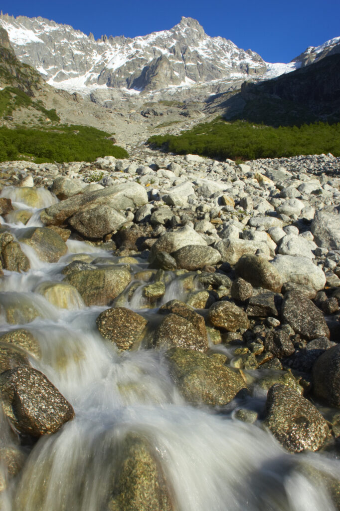 Switzerland Valais Val Ferret. A sream running through a dramatic mountain landscape near the village of La Fouly