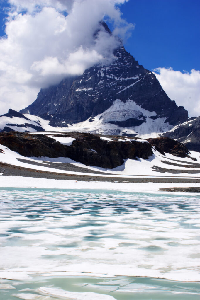 Switzerland Valais, Matterhorn. Ice covered lake in a landscape dominated by the peak of the Matterhorn
