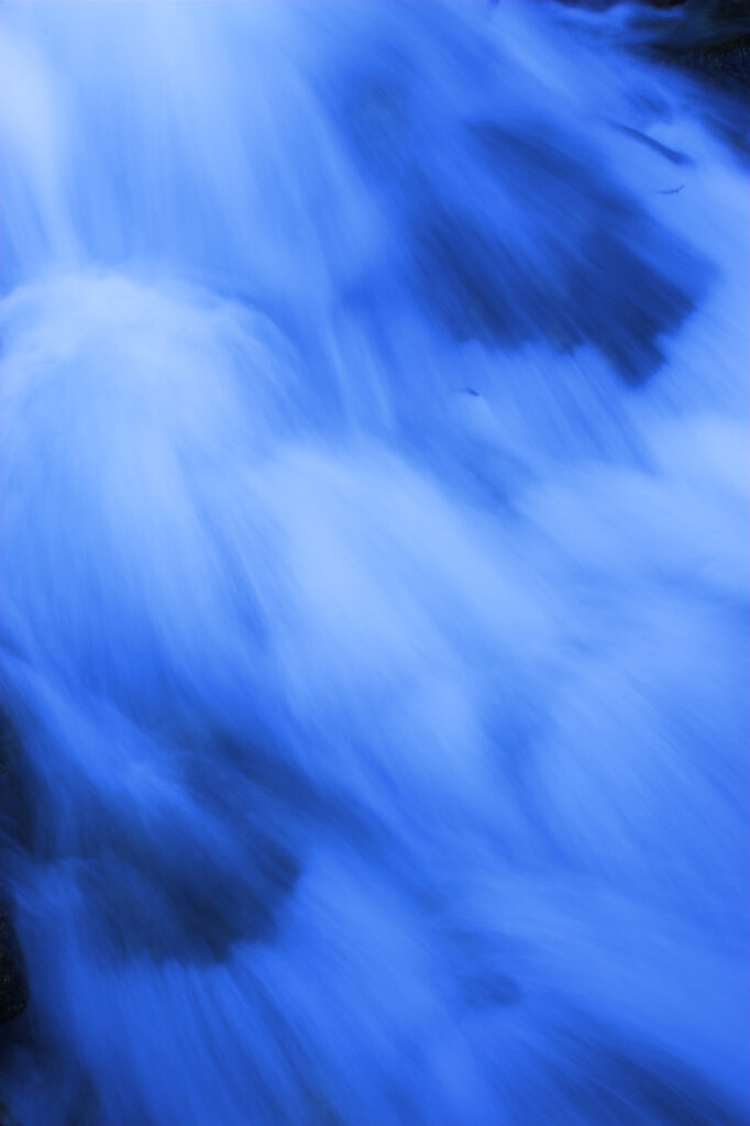 Switzerland, Valais, Val d Arpette. A mountains stream running downstream from a glacier.