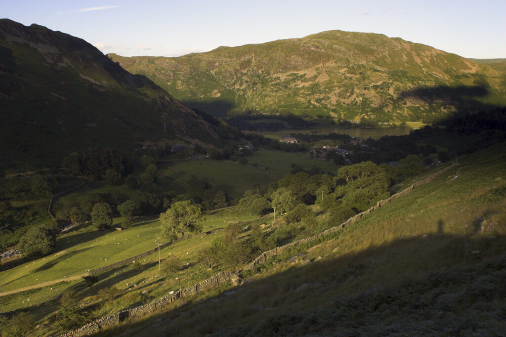England Cumbria Lake District National Park The golden hues of sunset illuminate the wild valley of Glenridding nr Ullswater