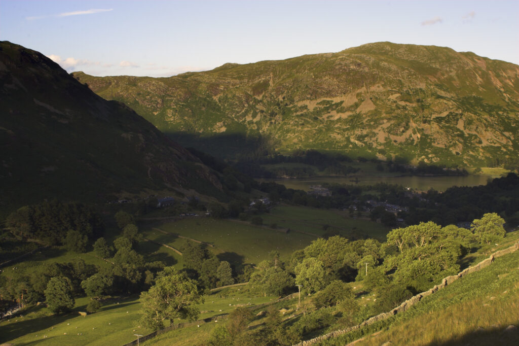 England Cumbria Lake District National Park The golden hues of sunset illuminate the wild valley of Glenridding nr Ullswater