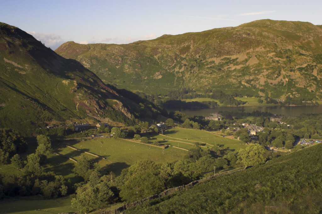 England Cumbria Lake District National Park The golden hues of sunset illuminate the wild valley of Glenridding nr Ullswater