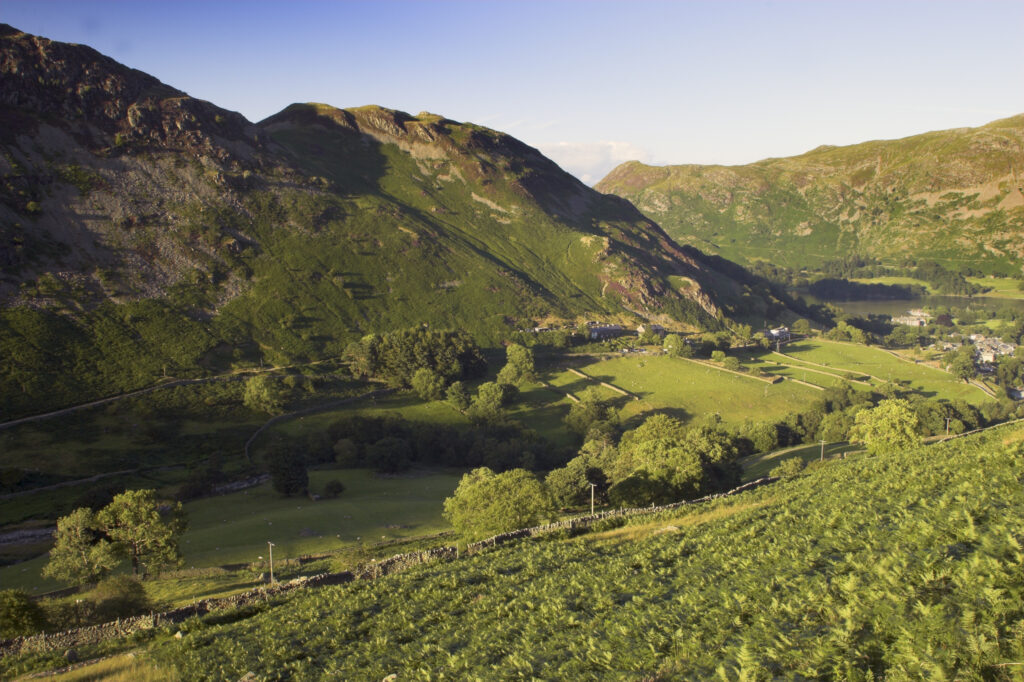 England Cumbria Lake District National Park The golden hues of sunset illuminate the wild valley of Glenridding nr Ullswater