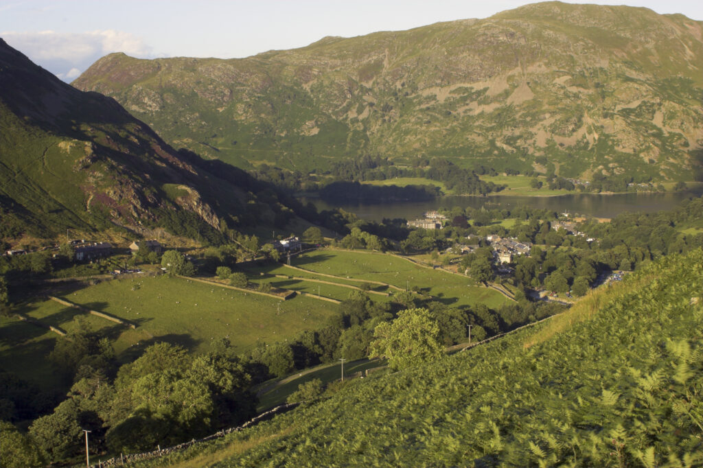 England Cumbria Lake District National Park The golden hues of sunset illuminate the wild valley of Glenridding nr Ullswater