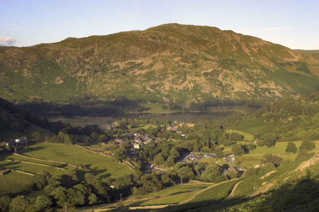England Cumbria Lake District National Park The golden hues of sunset illuminate the wild valley of Glenridding nr Ullswater