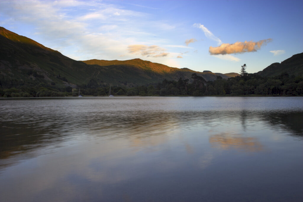 England Cumbria Ullswater The surrounding hills reflected in the waters of Ullswater, part of the Lake District National Park.