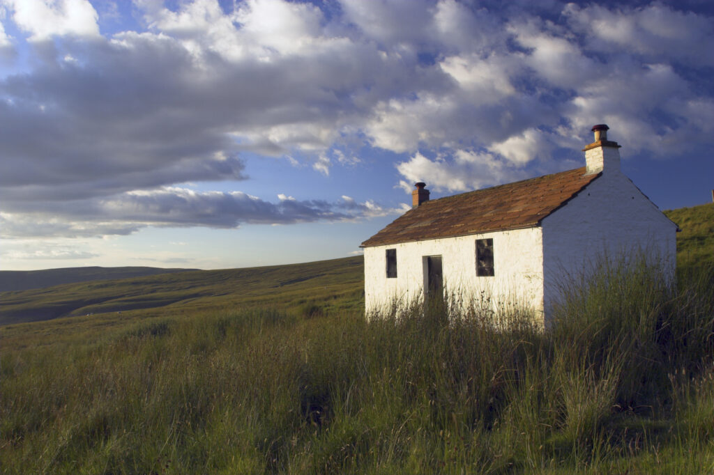 England, Cumbria, Hartside. A small cottage located within the barren landscape of Hartside Pass near Alston.