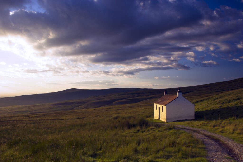 England, Cumbria, Hartside. A small cottage located within the barren landscape of Hartside Pass near Alston.