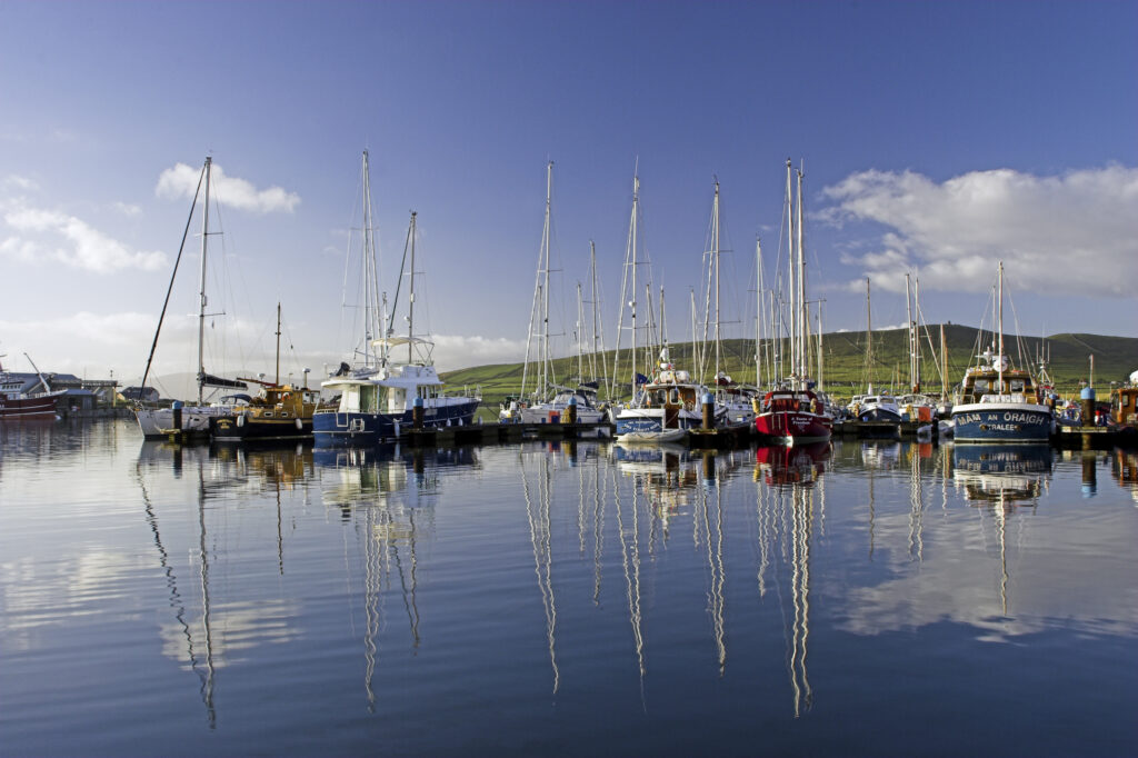 Ireland County Kerry Dingle Peninsula Boats reflected in the still waters of the Dingle Harbour in Dingle Bay