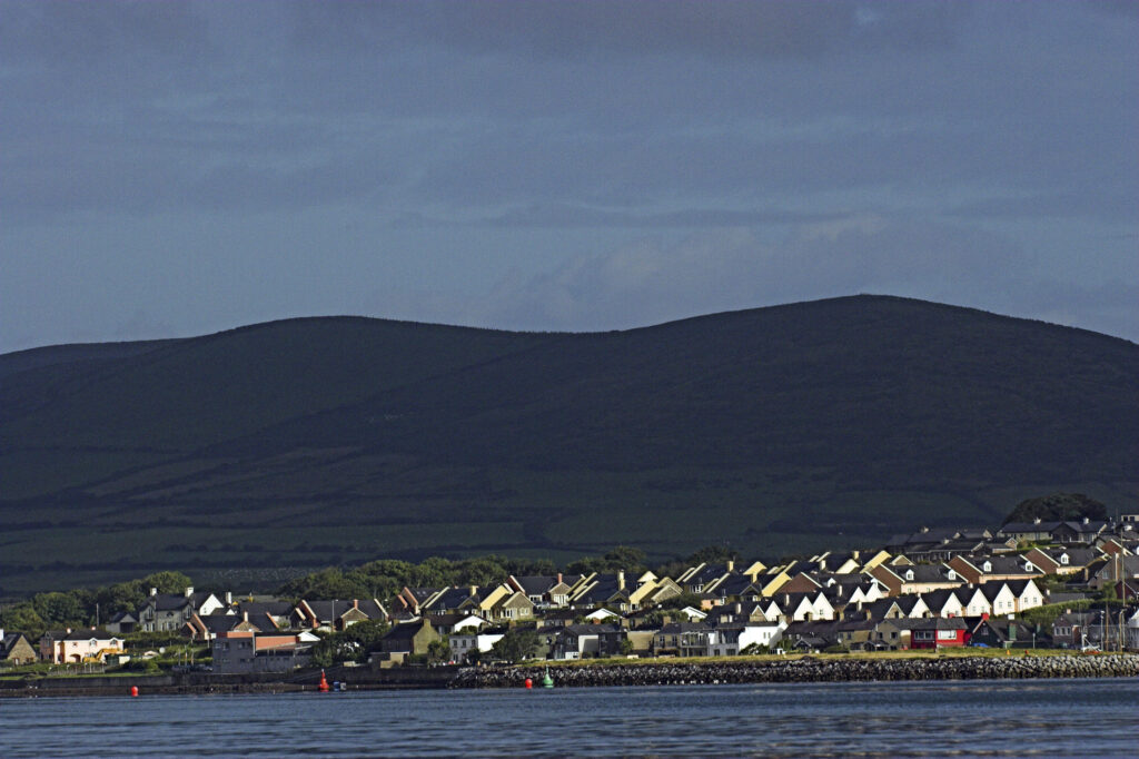 Ireland County Kerry Dingle Peninsula The town of Dingle against a backdrop of mountains viewed from Dingle Bay
