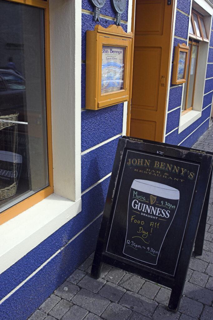 Ireland County Kerry Dingle A guinness stout sign outside a pub in the town of Dingle