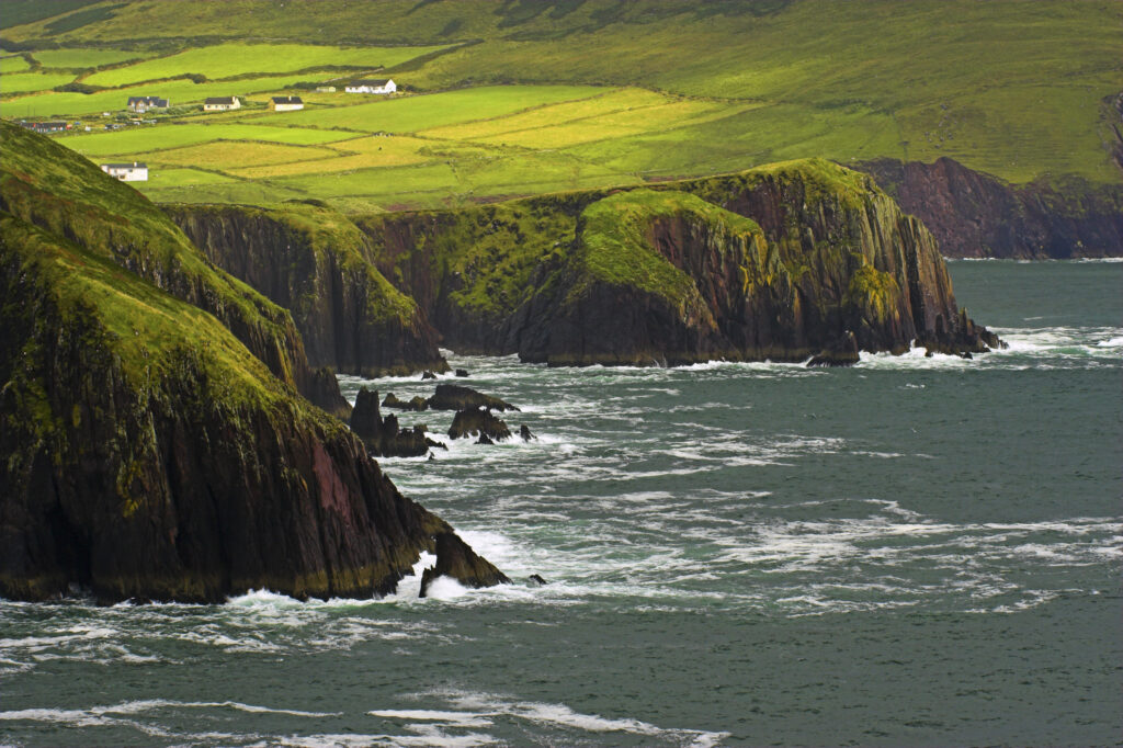 Ireland County Kerry Dingle Peninsula Waves crash against the sheer cliffs of Dingle Bay in the Dingle Peninsula