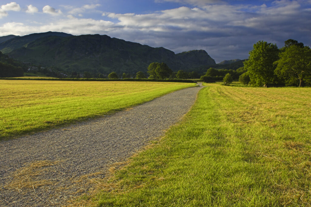 England, Cumbria, Lake District National Park. Evening light illuminates the Cumbria Way Track near Coniston.