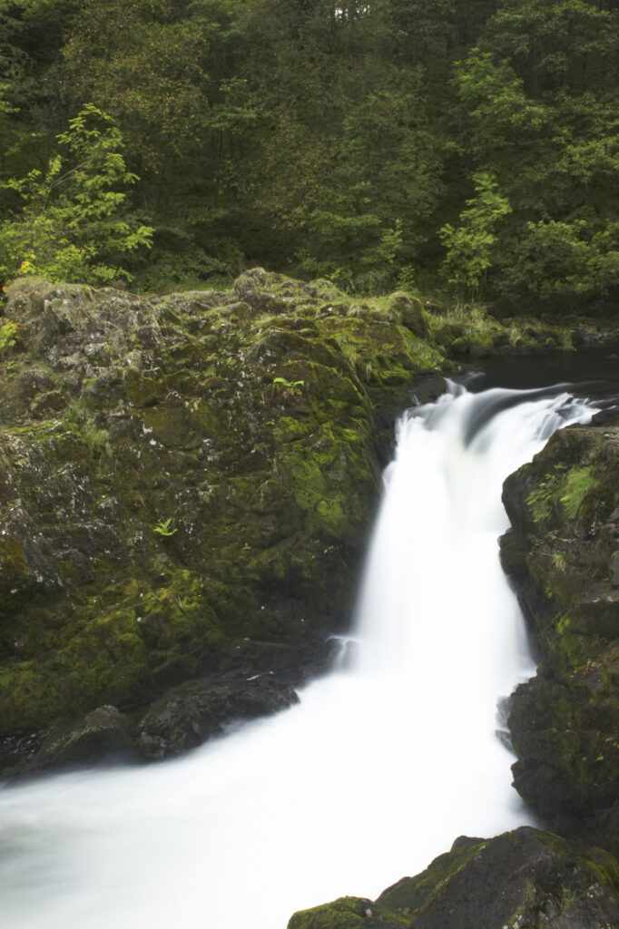 England, Cumbria, Lake District National Park. The fast flowing cascades of Skelwith Force near Skelwith Bridge.