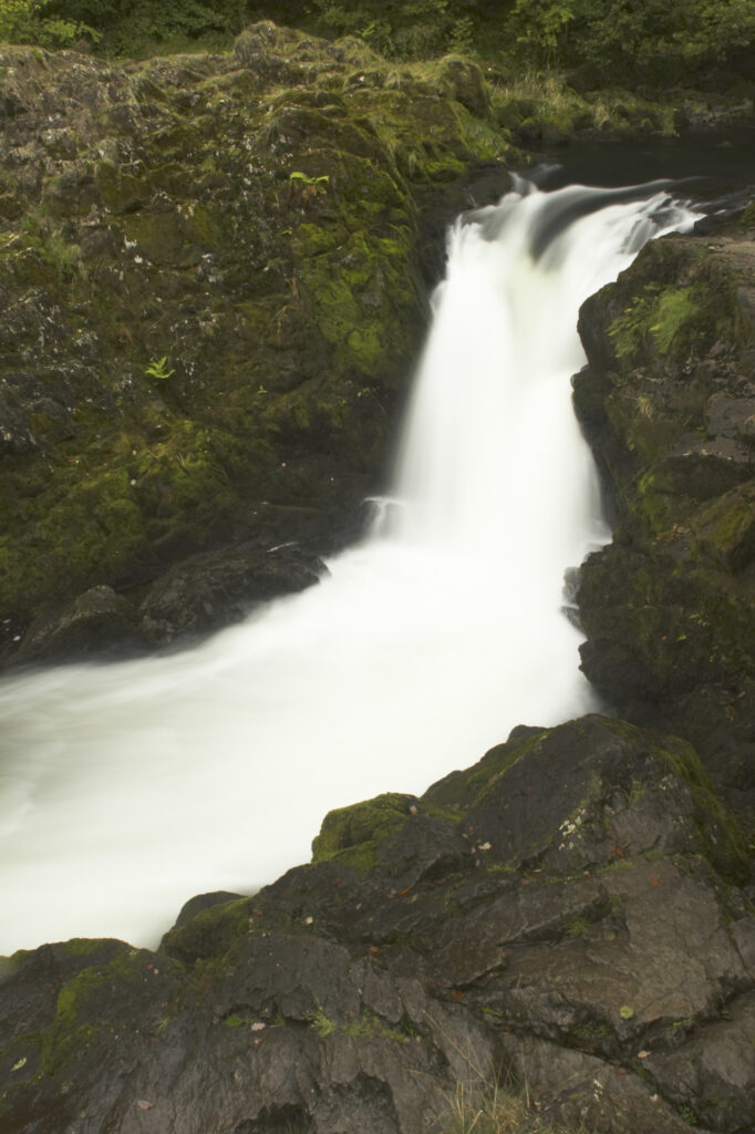 England, Cumbria, Lake District National Park. The fast flowing cascades of Skelwith Force near Skelwith Bridge.