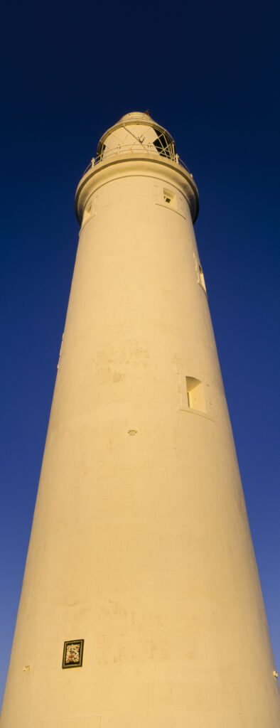 ENGLAND Tyne and Wear St Marys Island Warm evening sun illuminates the popular whitley bay landmark of the lighthouse