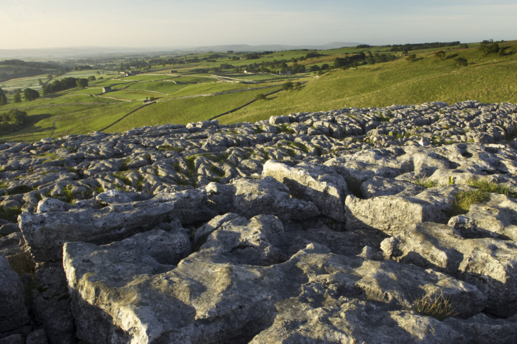 England, Yorkshire, Yorkshire Dales National Park. The impressive natural rock formations / geology of limestone paving above Malham Cove in the Yorkshire Dales National Park, in Yorkshire.