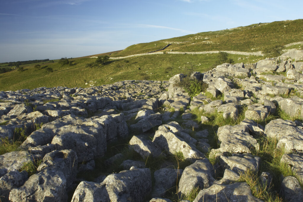 England, Yorkshire, Yorkshire Dales National Park. The impressive natural rock formations / geology of limestone paving above Malham Cove in the Yorkshire Dales National Park, in Yorkshire.