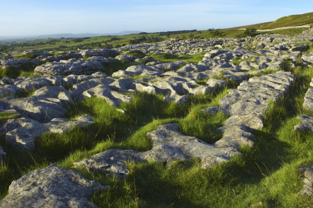 England, Yorkshire, Yorkshire Dales National Park. The impressive natural rock formations / geology of limestone paving above Malham Cove in the Yorkshire Dales National Park, in Yorkshire.