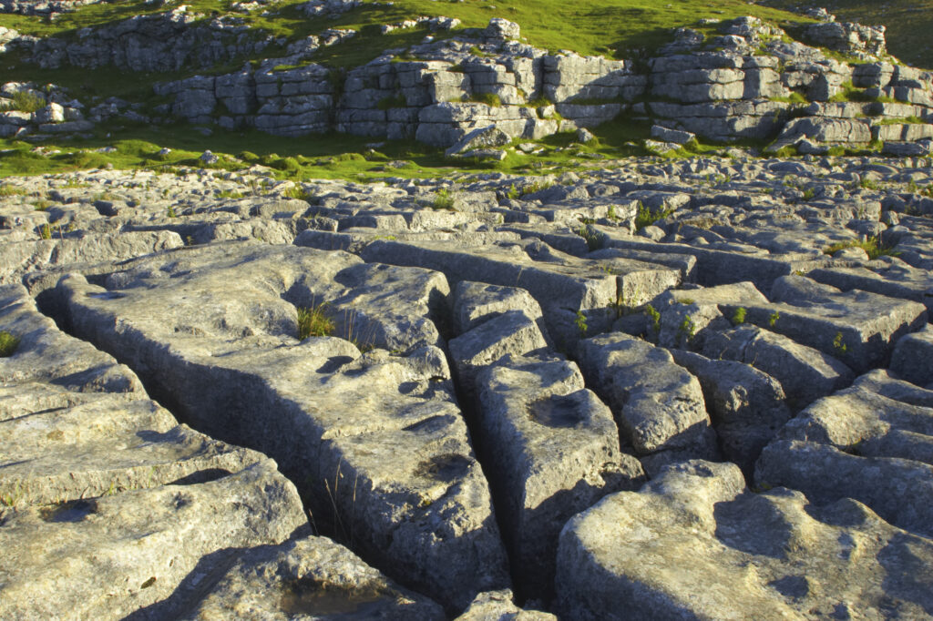 England, Yorkshire, Yorkshire Dales National Park. The impressive natural rock formations / geology of limestone paving above Malham Cove in the Yorkshire Dales National Park, in Yorkshire.