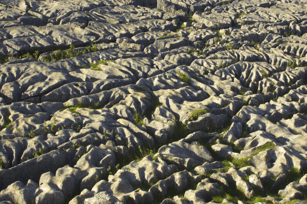 England, Yorkshire, Yorkshire Dales National Park. The impressive natural rock formations / geology of limestone paving above Malham Cove in the Yorkshire Dales National Park, in Yorkshire.
