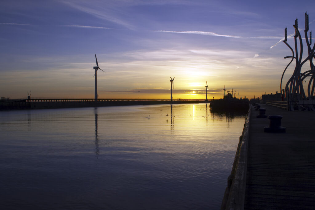 England, Northumberland, Blyth offshore wind farm. Dawn, looking towards the wind turbines generating renewable electricity.