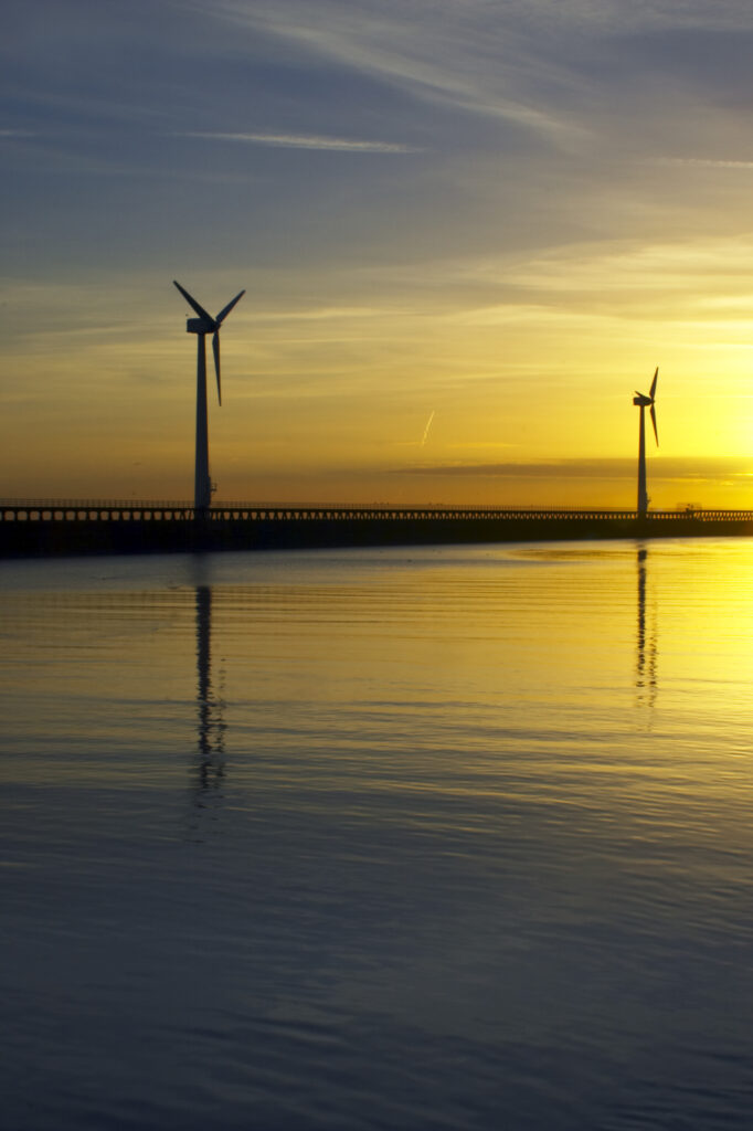 England, Northumberland, Blyth offshore wind farm. Dawn, looking towards the wind turbines generating renewable electricity.