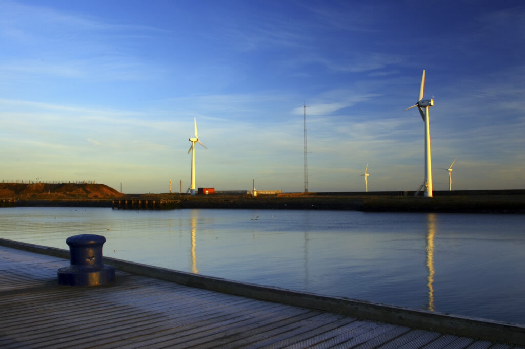England, Northumberland, Blyth offshore wind farm. Dawn, looking towards the wind turbines generating renewable electricity.