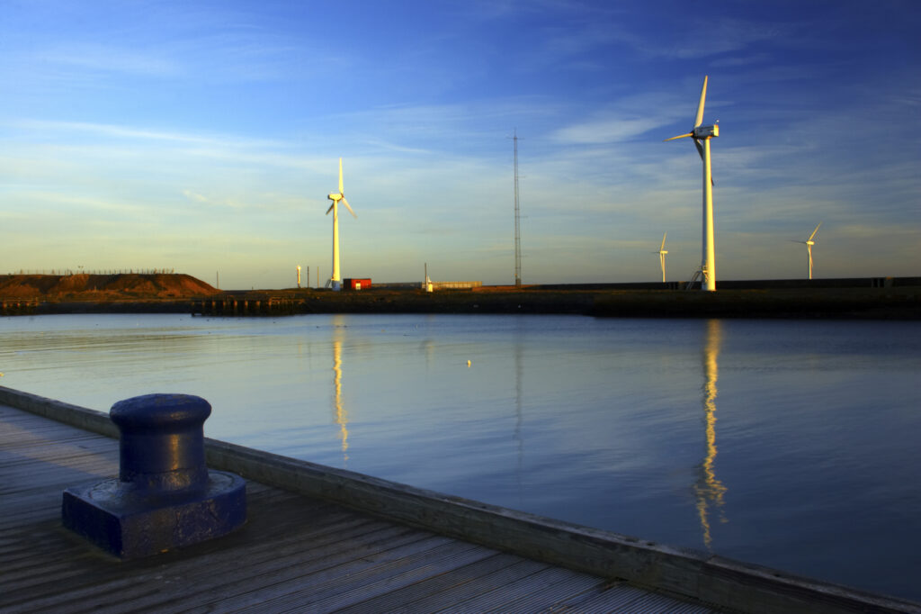England, Northumberland, Blyth offshore wind farm. Dawn, looking towards the wind turbines generating renewable electricity.