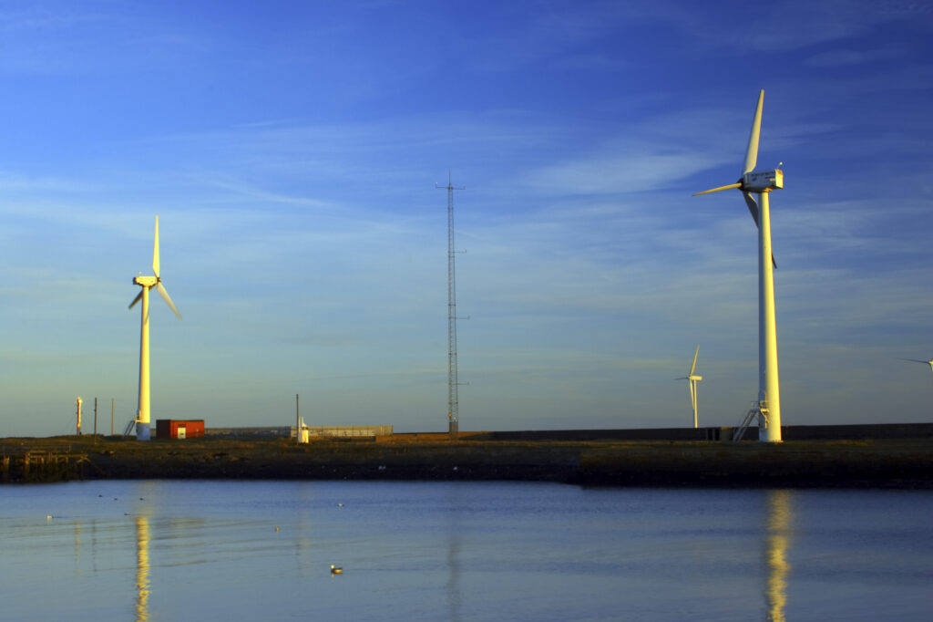 England, Northumberland, Blyth offshore wind farm. Dawn, looking towards the wind turbines generating renewable electricity.