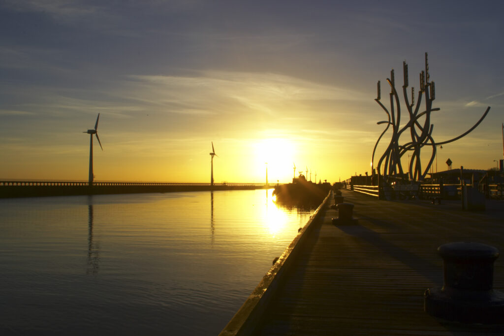 England, Northumberland, Blyth offshore wind farm. Dawn, looking towards the wind turbines generating renewable electricity.