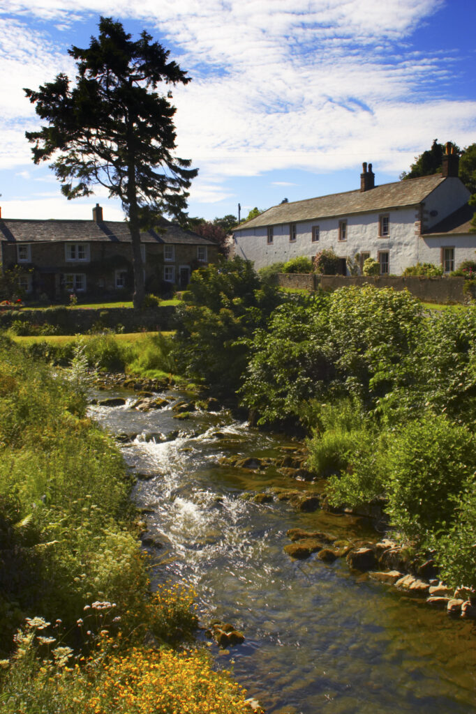 England, Cumbria, Lake District National Park. The gentle flow of the Cald beck, running through Caldbeck village.