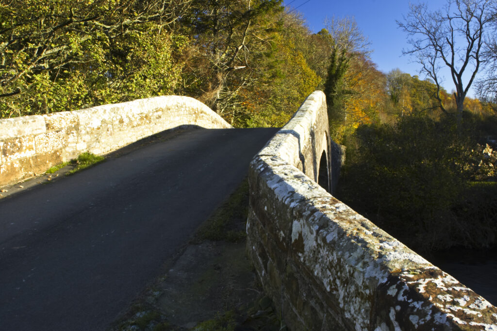 England, Cumbria, Cumbria Way Track. Bell Bridge, stretching over the River Caldrew.