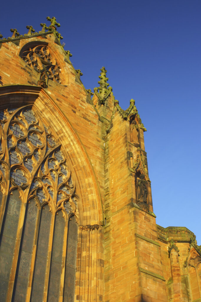England, Cumbria, Carlisle Cathedral. Early morning winter sun illuminates the red sandstone of Carlisle Cathedral.
