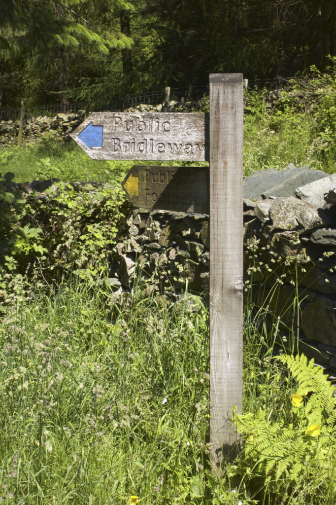 England, Cumbria, Lake District National Park. Public Bridleway and public footpath sign near High Oxen Fell.