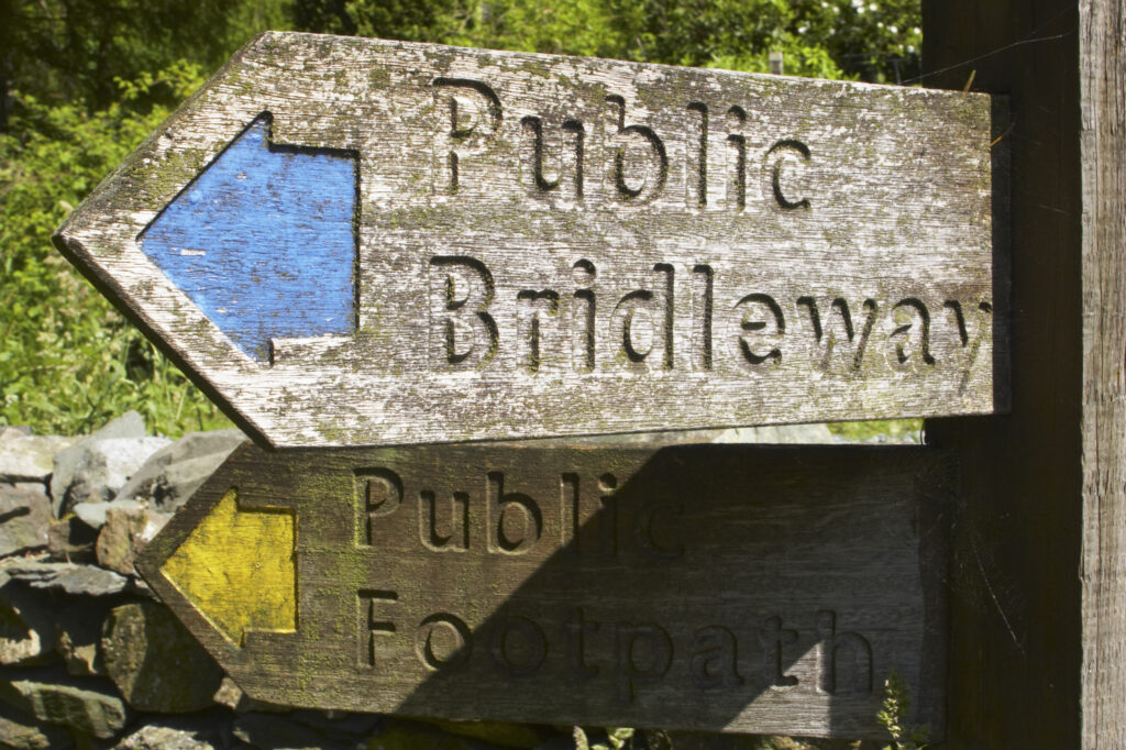 England, Cumbria, Lake District National Park. Public Bridleway and public footpath sign near High Oxen Fell.