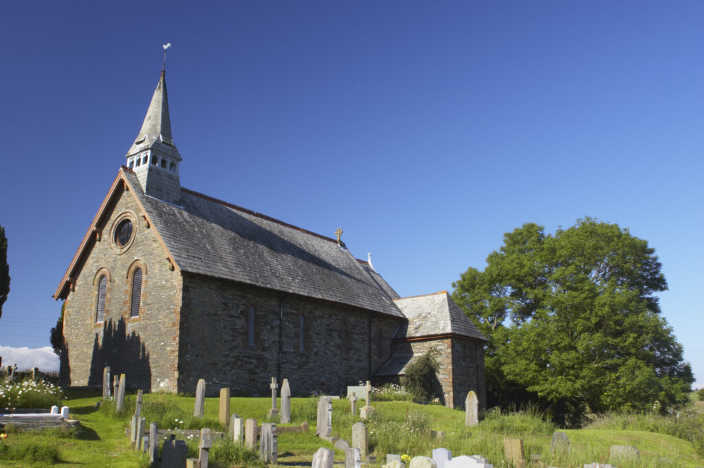 England, Cumbria, Osmotherly. The church of St John and the surrounding grounds, near Ulverston, during the summer months.