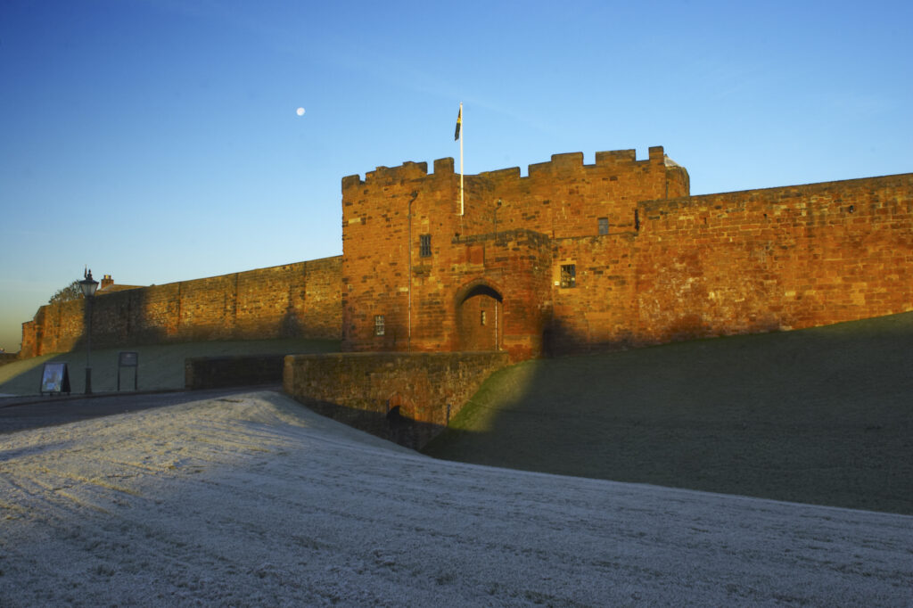 England, Cumbria, Carlisle Castle. Early morning winter sun illuminates the red sandstone of Carlisle Castle.