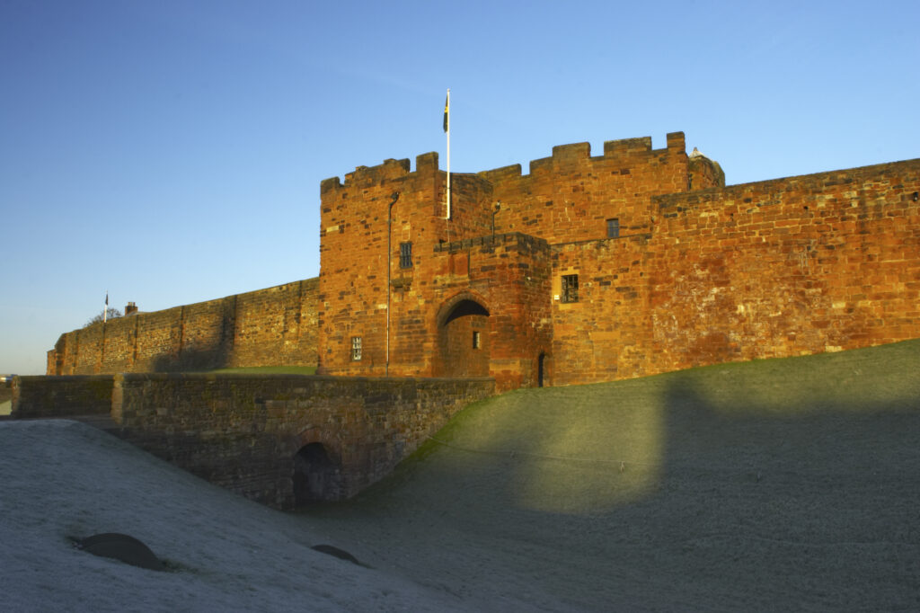 England, Cumbria, Carlisle Castle. Early morning winter sun illuminates the red sandstone of Carlisle Castle.