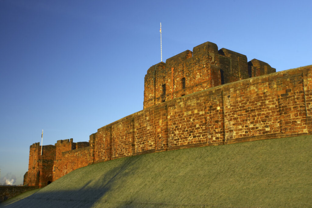 England, Cumbria, Carlisle Castle. Early morning winter sun illuminates the red sandstone of Carlisle Castle.