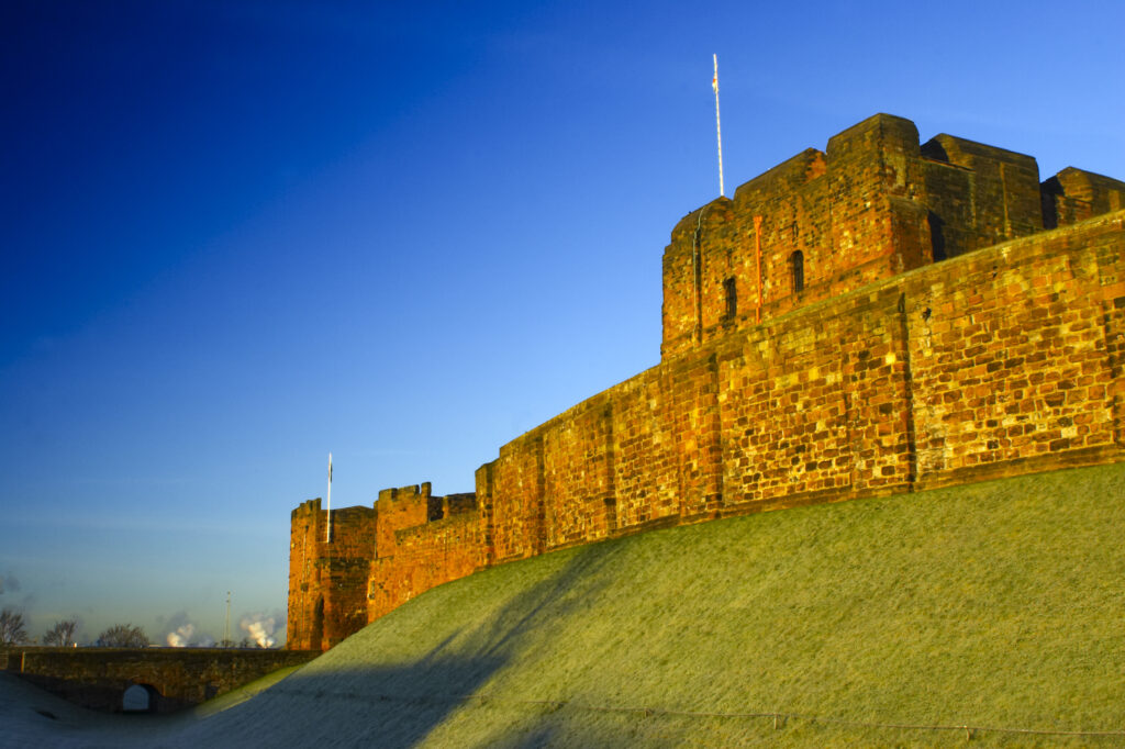 England, Cumbria, Carlisle Castle. Early morning winter sun illuminates the red sandstone of Carlisle Castle.
