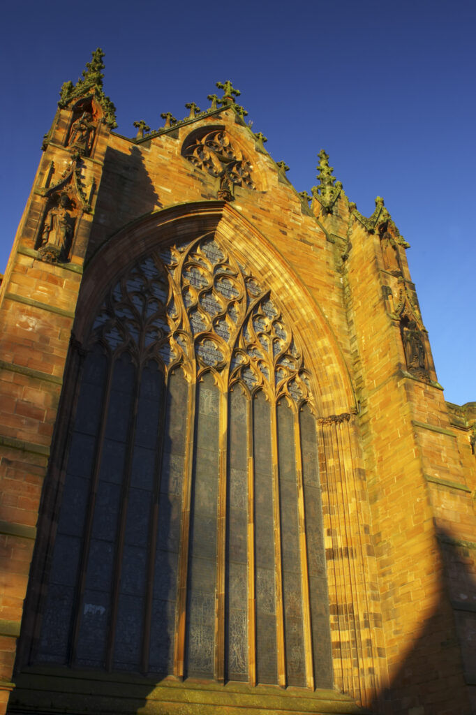 England, Cumbria, Carlisle Cathedral. Early morning winter sun illuminates the red sandstone of Carlisle Cathedral.