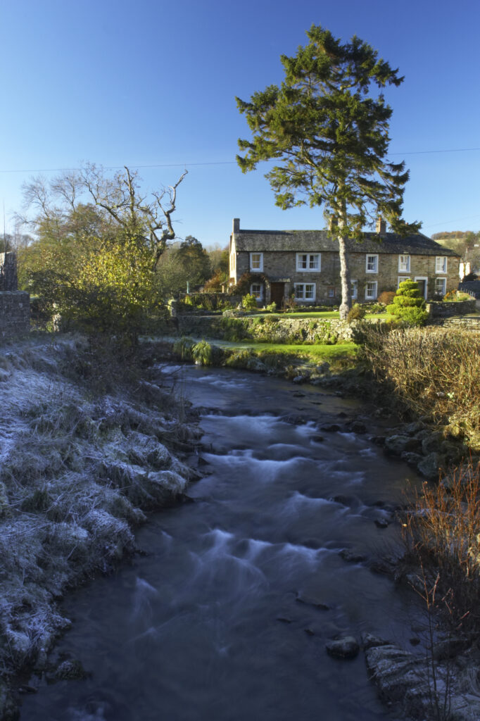 England, Cumbria, Lake District National Park. The gentle flow of the Cald beck, running through Caldbeck village.