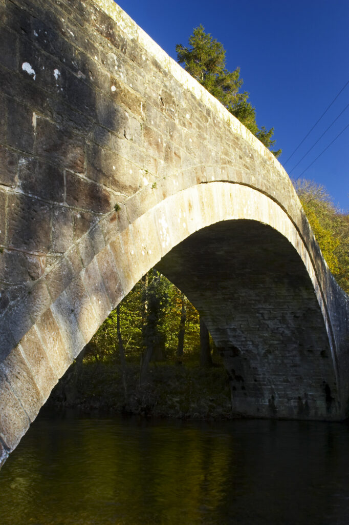 England, Cumbria, Cumbria Way Track. Bell Bridge, stretching over the River Caldrew.