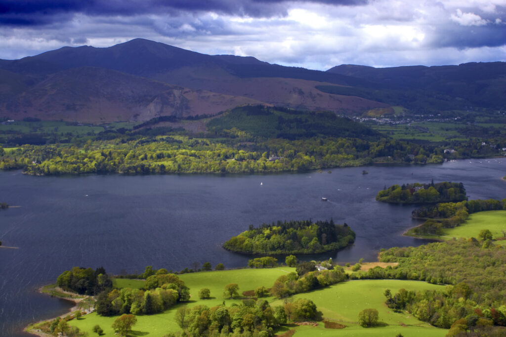 England, Cumbria, Lake District National Park. View looking towards Derwent Water lake against a dramatic backdop of mountains.